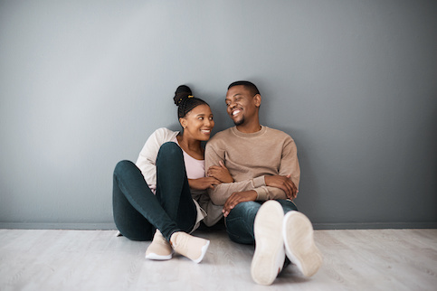 The First Time Home Buyer Tax Credit Quicken Loans   Stock Smiling Man And Woman In New Home AdobeStock 548657647 